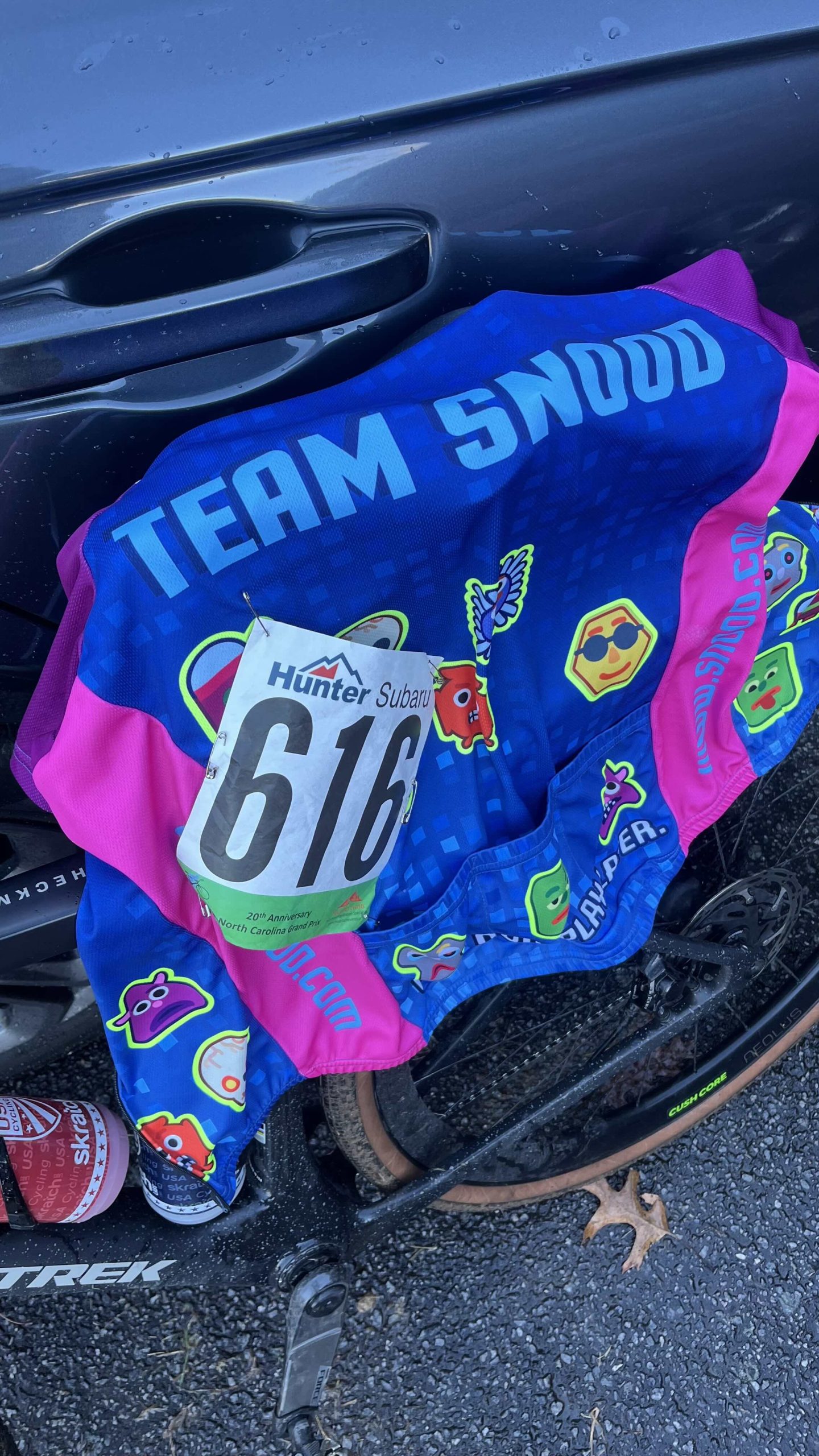 Snood Bike Jersey with race number draped on bike
